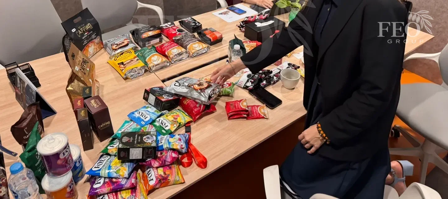 Reviewing real Caffino samples at a working meeting in Jakarta — a face-free detail